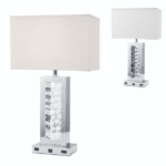The Monica Table Lamp product image. It features a usb port and AC port on the base of the lamp for all of your charging needs as well as a beautiful mirror finish.