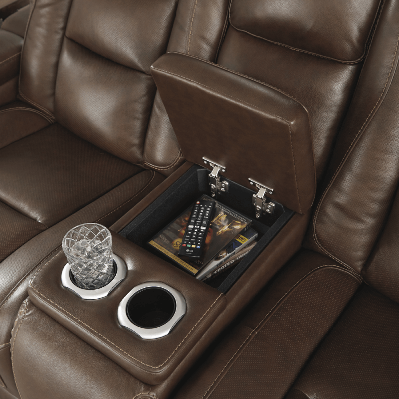 The Man-Den Triple Power Reclining Loveseat with Console By Ashley black background storage console product image