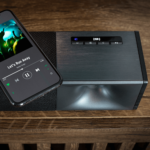 Cinema 600 Sound Bar By Klipsch sound bar close up with phone showing bluetooth product image