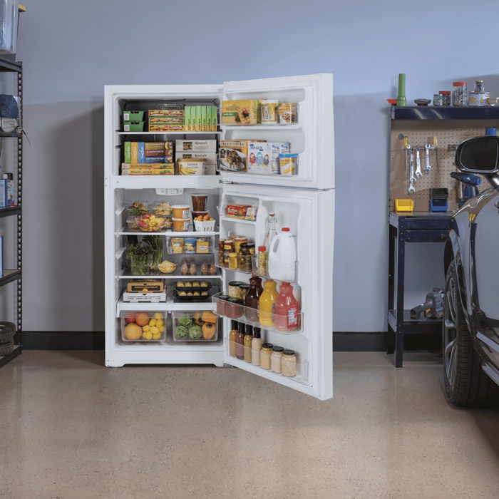 GE® 21.9 Cu. Ft. Top-Freezer Refrigerator in White in Garage product image